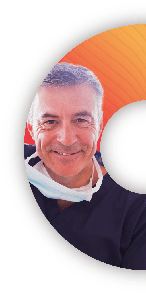 A middle-age male dentist in a navy blue dentist uniform smiling