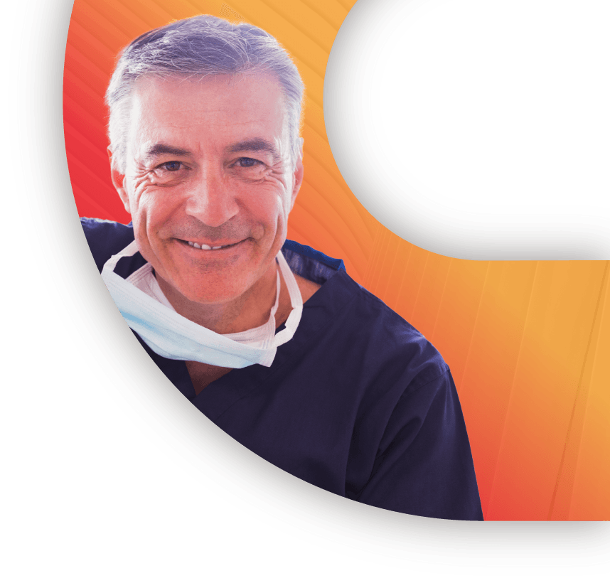 A middle-age male dentist in a navy blue dentist uniform smiling